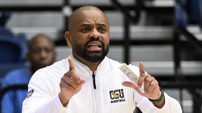 Juan Dixon on a basketball court sideline