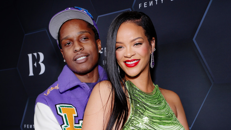 A$AP Rocky holding smiling Rihana