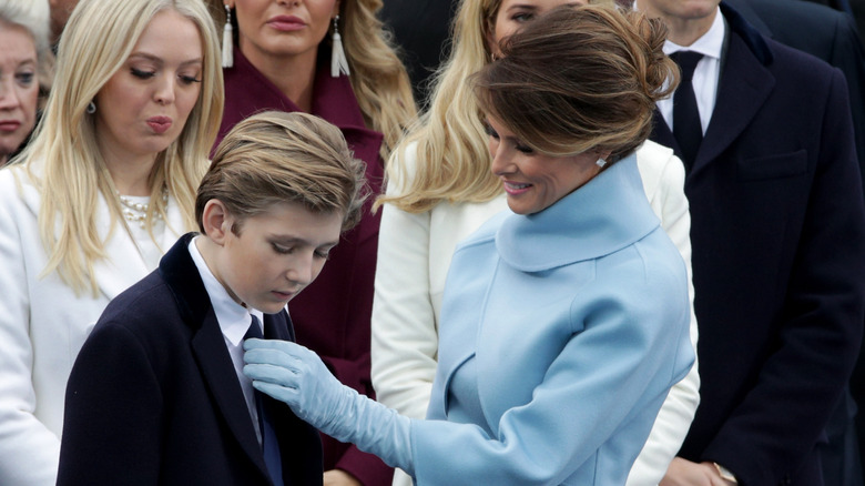 Melania Trump fixing Barron Trump's tie