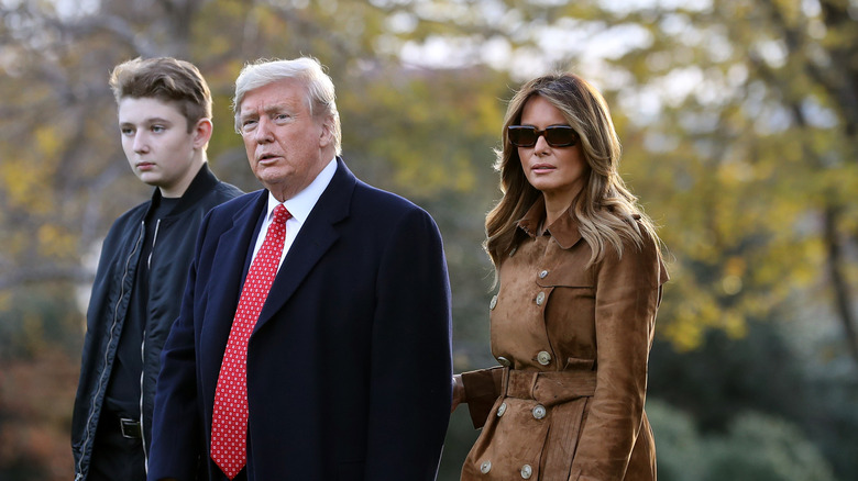 Barron Trump, Donald Trump, and Melania Trump walking