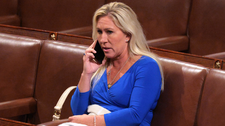 Marjorie Taylor Greene talking on the phone before Donald Trump's joint session of Congress at the U.S. Capitol