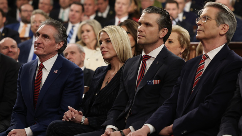 U.S. Secretary of the Interior Doug Burgum, Attorney General Pam Bondi, Secretary of Defense Pete Hegseth, and Treasury Secretary Scott Bessent listening as U.S. President Donald Trump address to a joint session of Congress at the U.S. Capitol