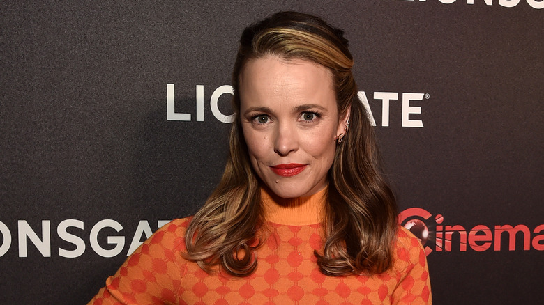 Rachel McAdams wears an orange printed dress