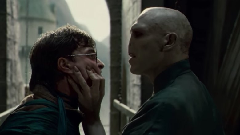 Ralph Fiennes as Lord Voldemort, Daniel Radcliffe as Harry Potter