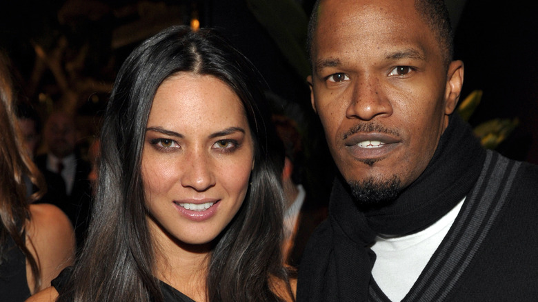 Jamie Foxx and Olivia Munn posing