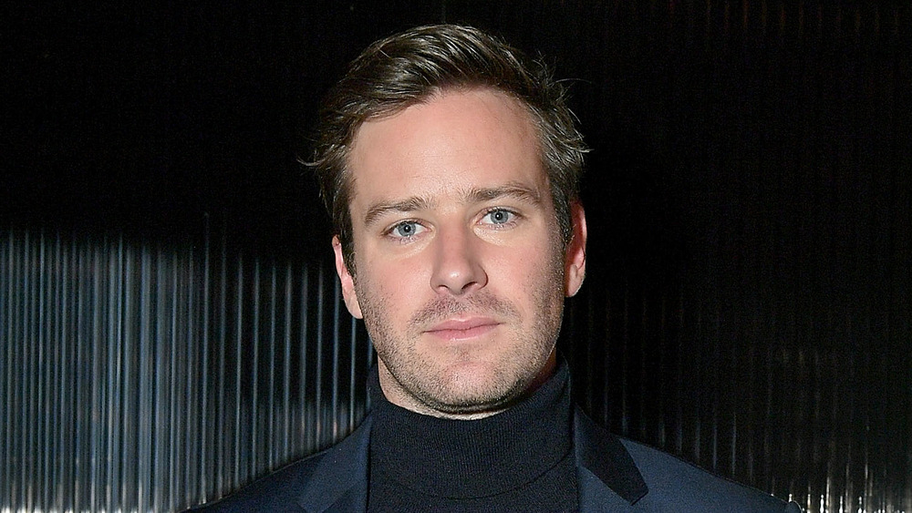 Armie Hammer stares into the camera