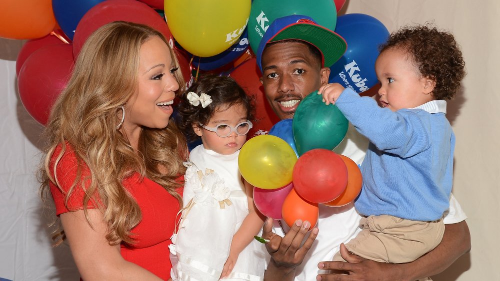 Recording artist Mariah Carey, her husband Nick Cannon and their children Monroe Cannon (L) and Moroccan Cannon attend "Family Day" hosted by Nick Cannon