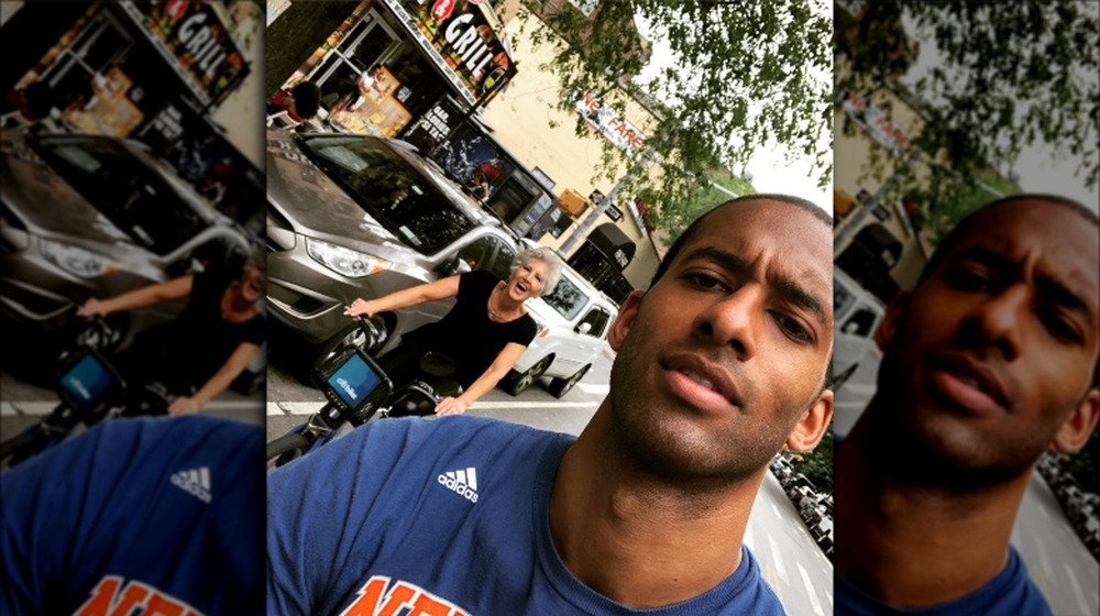 Matt James taking a selfie with his mother while riding bikes