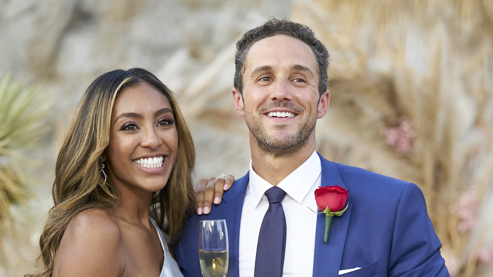 Tayshia Adams and Zac Clark posing together