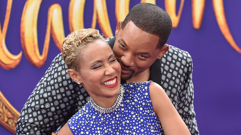 Will Smith behind laughing Jada Pinkett Smith