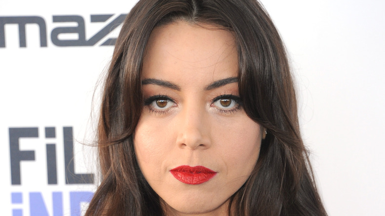 Aubrey Plaza looking at camera