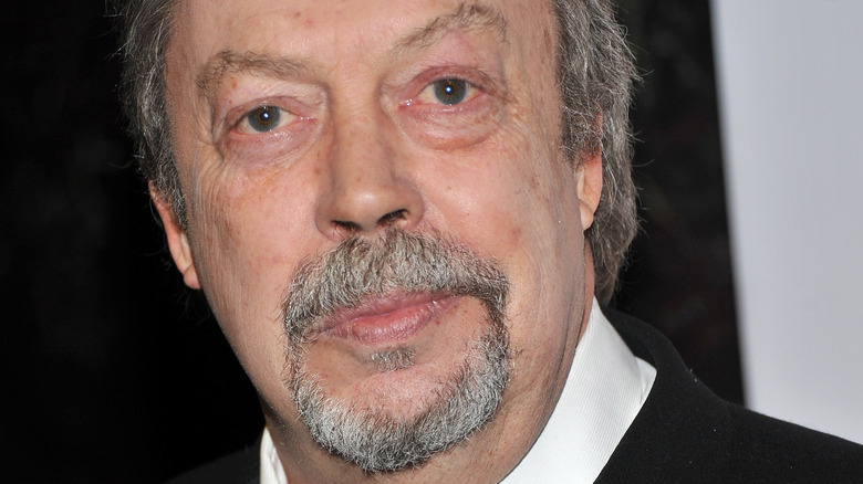 Tim Curry looking at camera