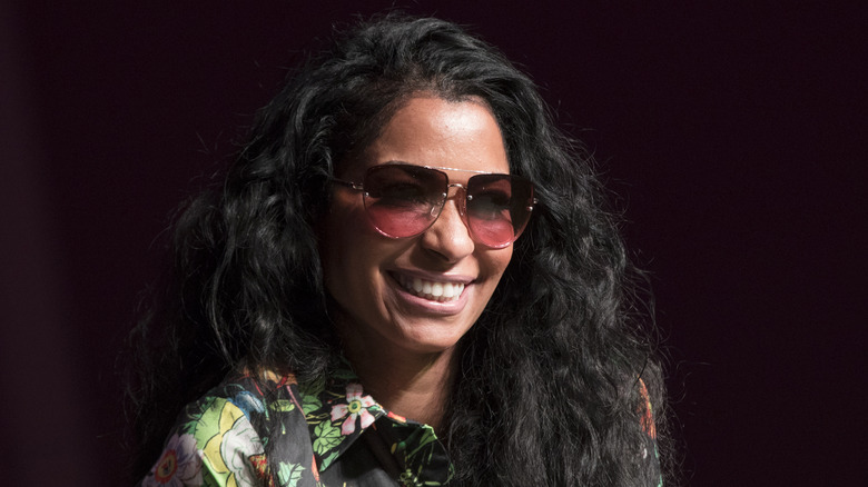 Karlie Redd smiling and wearing sunglasses