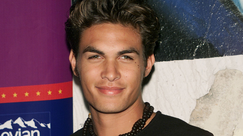 Young Jason Momoa smiling