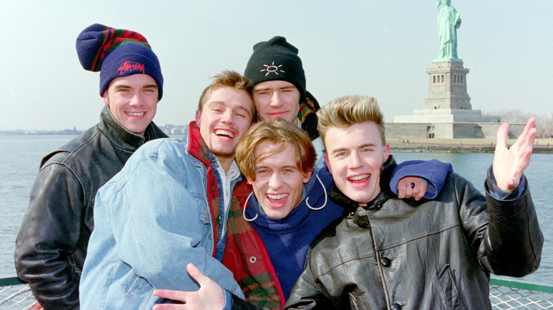 Take That in New York by the statue of liberty