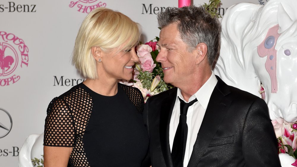 Yolanda Hadid and David Foster looking at one another