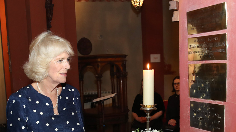 Camilla Parker Bowles visiting her great-grandmother's grave.