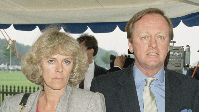 Camilla Parker Bowles standing next to Andrew Parker Bowles.