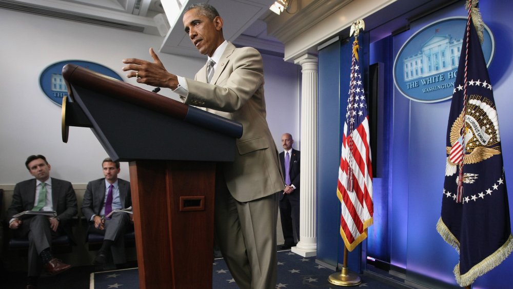 President Barack Obama wearing a tan suit at a press conference