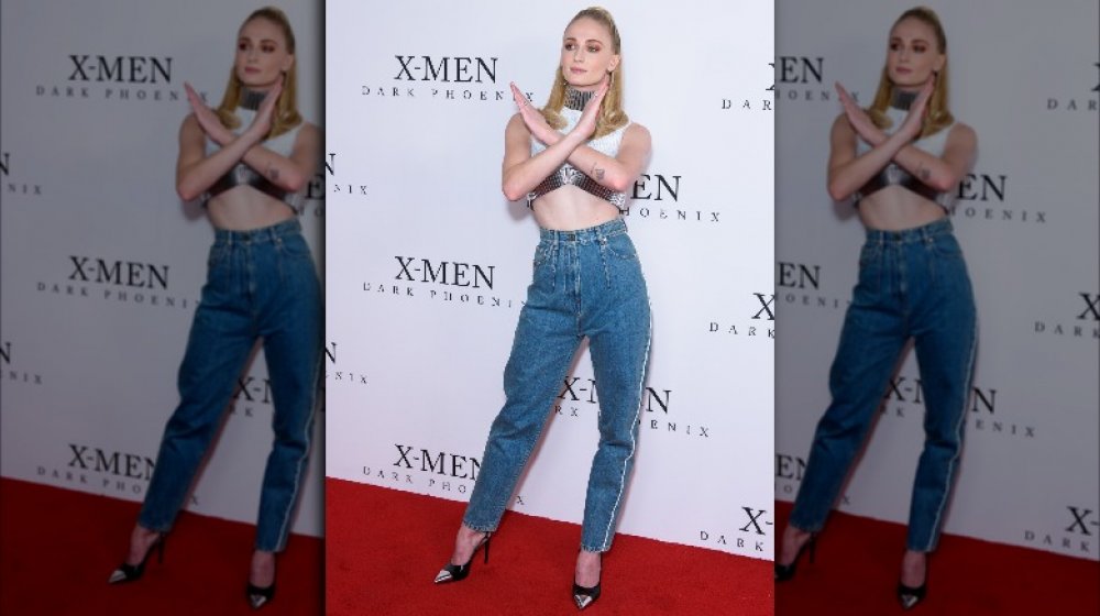 Sophie Turner crossing her arms at an X-Men fan event