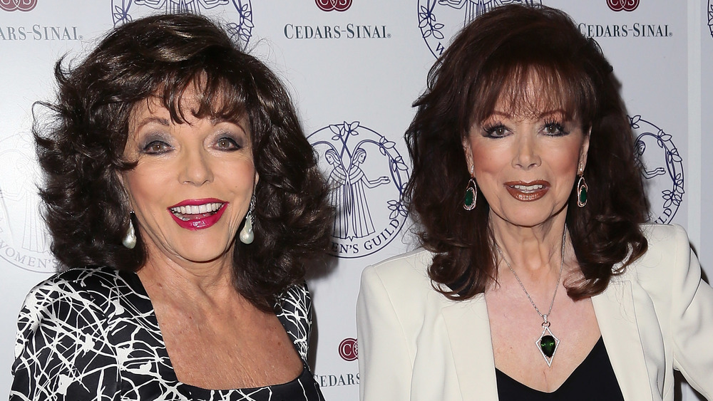 Joan Collins and Jackie Collins smiling