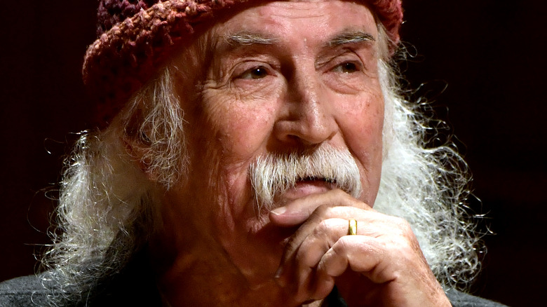 David Crosby posing, hand on chin