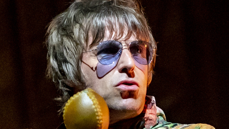 Liam Gallagher on stage performing