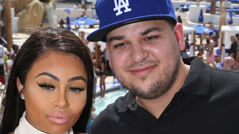 Black Chyna and Rob Kardashian posing at a water park