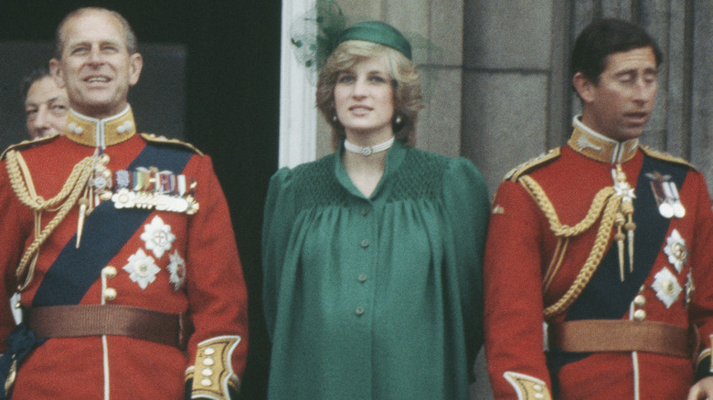 Pregnant Princess Diana standing in green dress