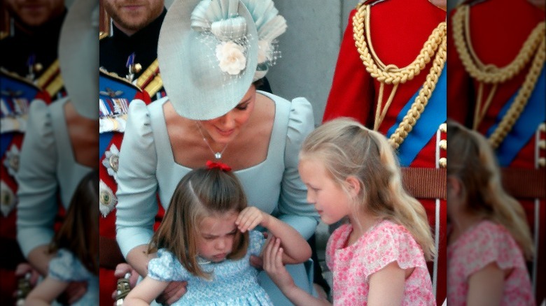 Kate Middleton holds Princess Charlotte crying