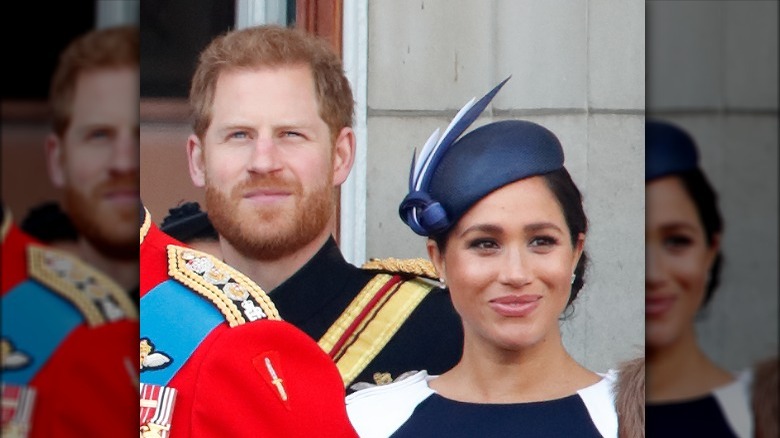 Prince Harry, Meghan Markle, both smiling