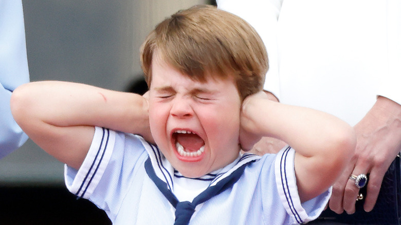 Prince Louis screaming, hands on ears