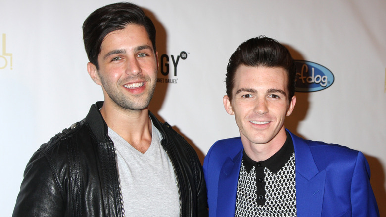 Josh Peck smiling with Drake Bell