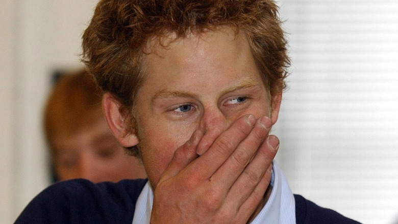 Prince Harry looking shocked, hand to mouth