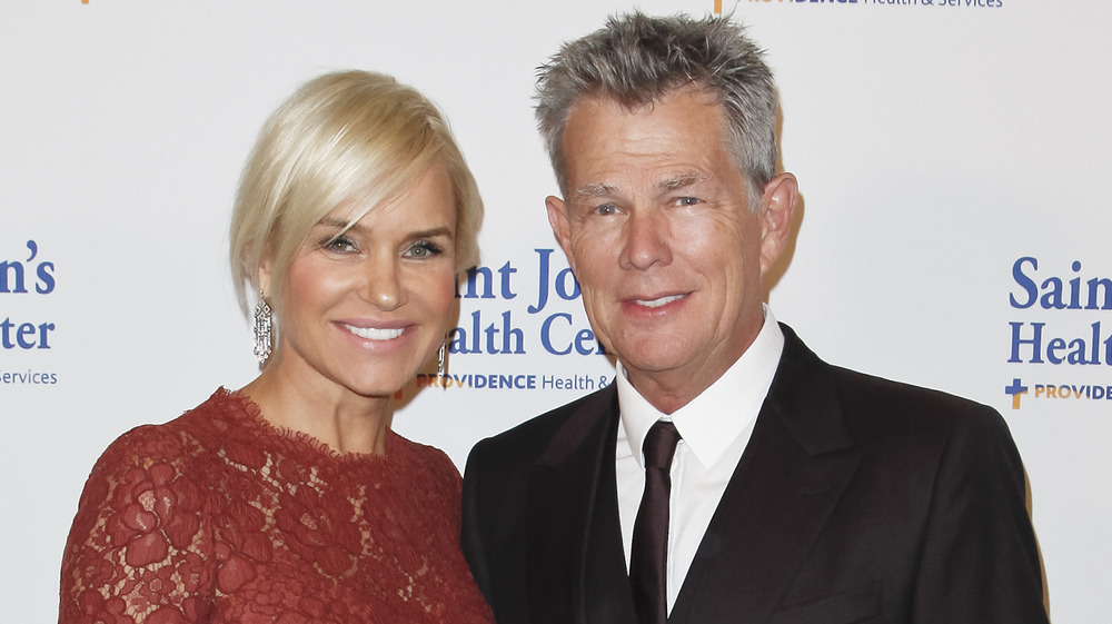 Yolanda Hadid and David Foster smiling on the red carpet