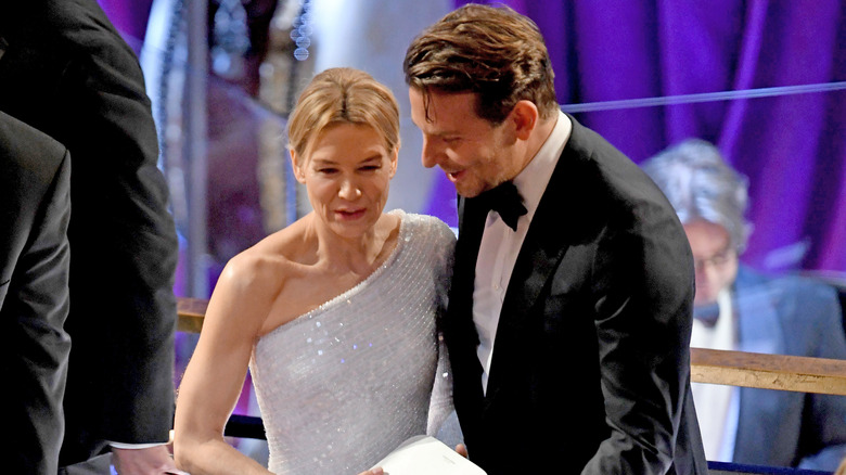 Renée Zellweger and Bradley Cooper, speaking