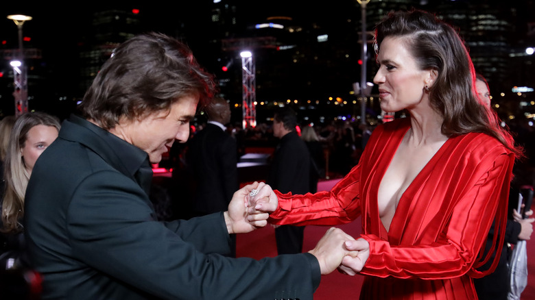 Tom Cruise and Hayley Atwell holding hands