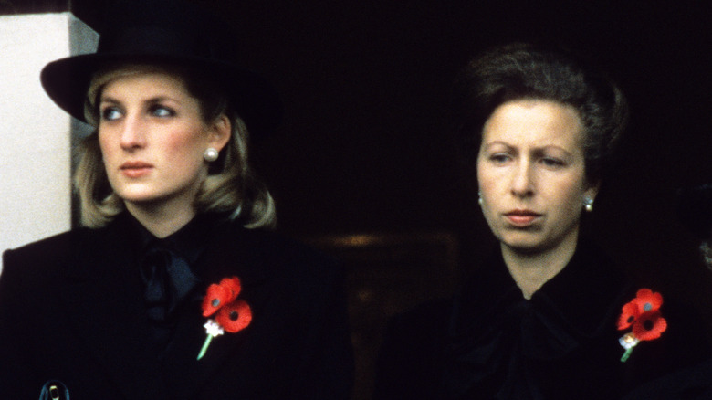 Princess Diana and Princess Anne looking annoyed at an event