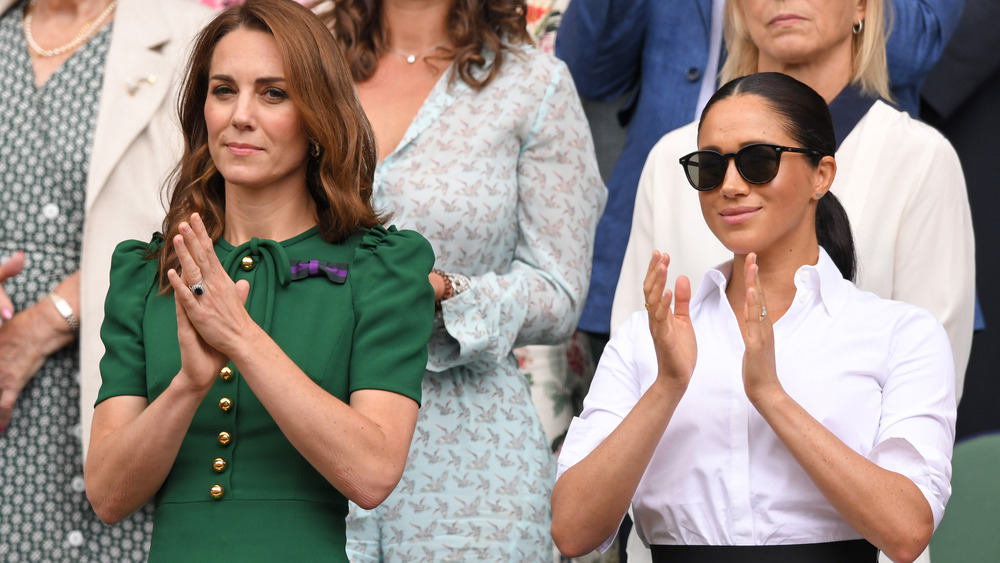 Meghan Markle and Kate Middleton applauding at Wimbledon