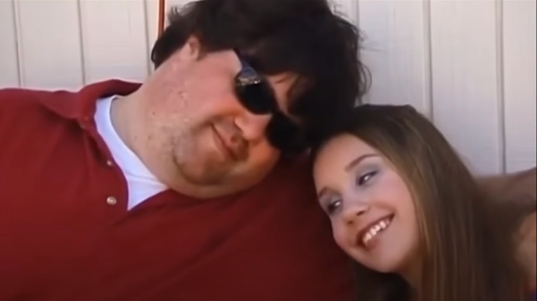 Dan Schneider cuddling Amanda Bynes