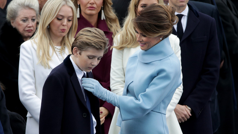 Melania Trump fixing Barron Trump's tie