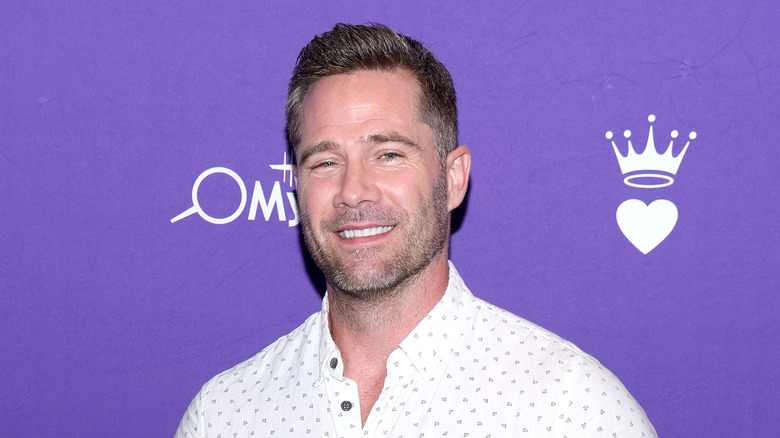 Luke Macfarlane smiling at Halmark event