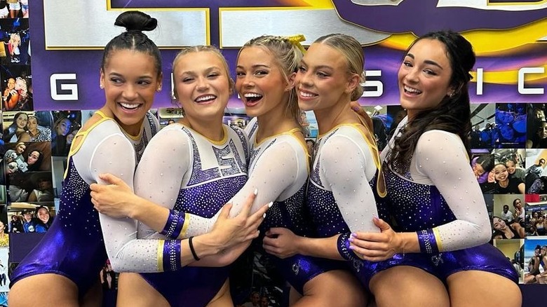 Olivia Dunne hugging LSU teammates