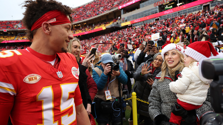 Patrick Mahomes smiling at Brittany Mahomes