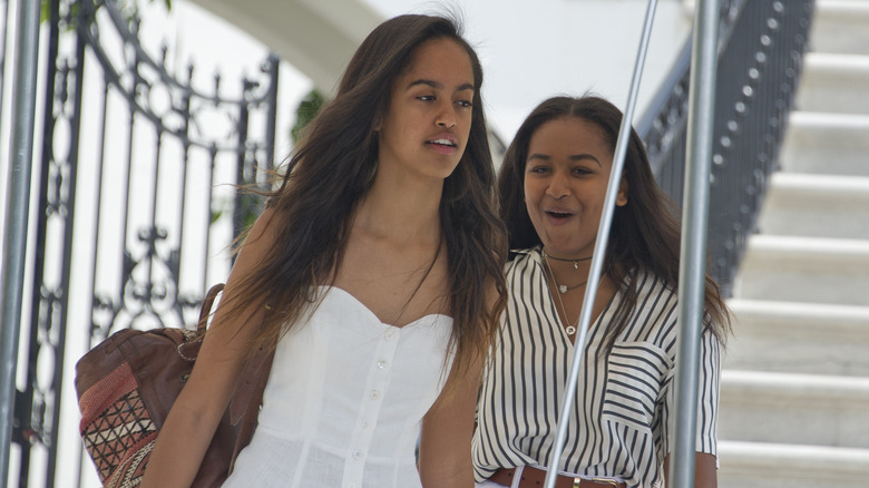 Malia and Sasha Obama departing the White House