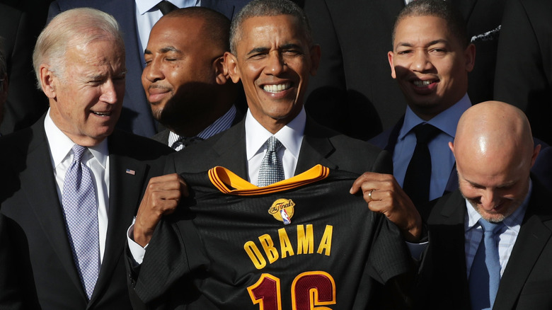 President Obama holds up a jersey