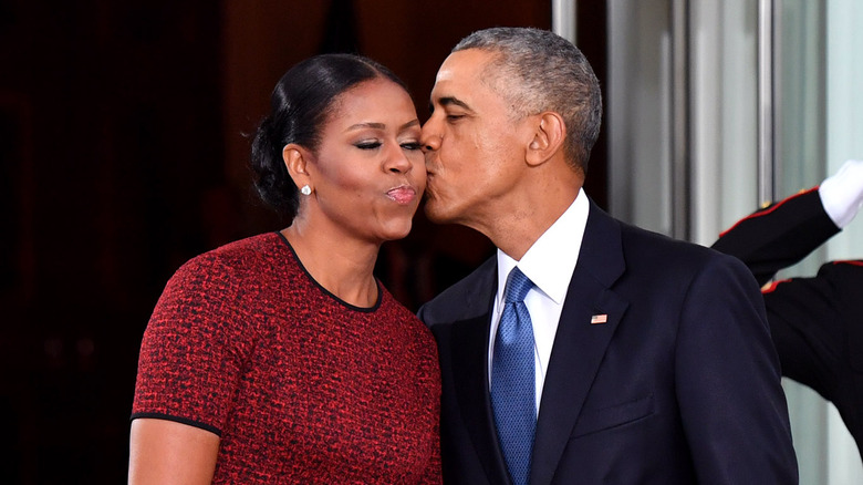 Barack Obama kissing Michelle on the cheek 