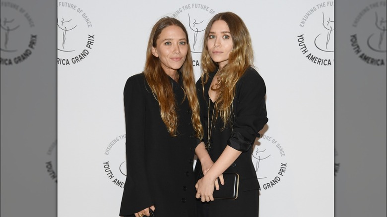 Mary-Kate Olsen Ashley Olsen hold hands