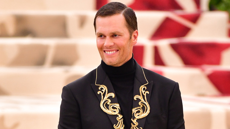 Tom Brady smiling at the Met Gala 