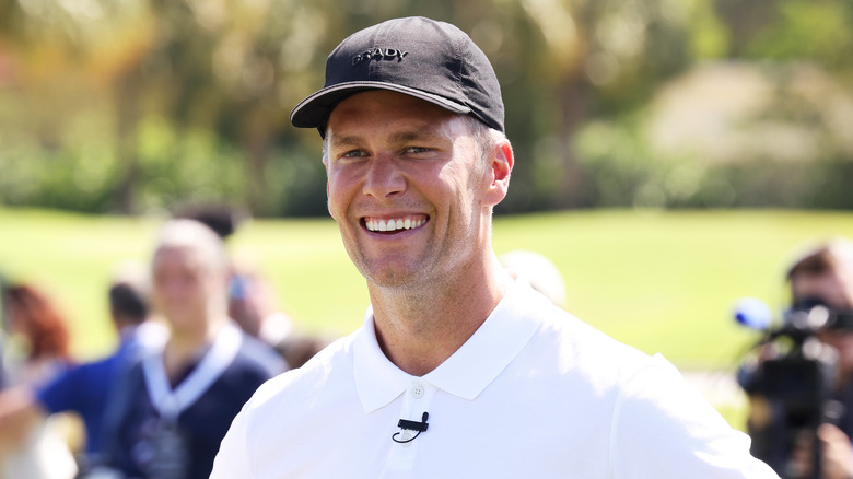 Tom Brady smiling on Miami golf course